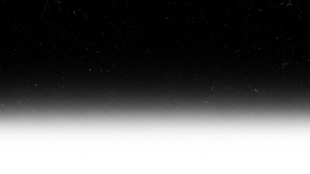 A black and white gradient background with visible film grain and scratches creates a distressed, vintage aesthetic.の素材