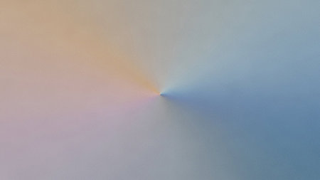 An abstract radial gradient features soft pastel colors like pink, orange, yellow, and blue emanating from a central point, creating a diffused...の素材