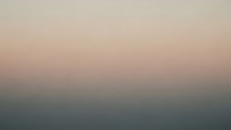 A smooth, soft gradient transitioning from a light pastel pink at the top to a muted gray at the bottom, creating a subtle backdrop.の素材
