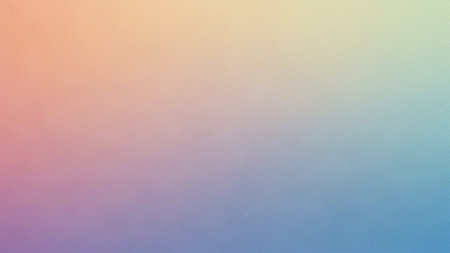 A soft, smooth gradient blends pastel colors from warm peach to cool blue with a subtle textured effect.の素材