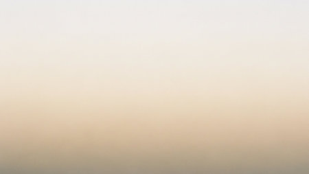 A pale, creamy gradient background with a subtle darker tone at the bottom, offering a soft and neutral visual.の素材