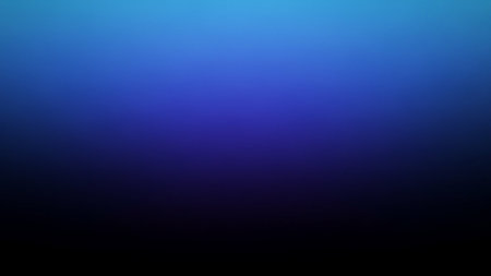 A smooth gradient transitions from bright sky blue to deep indigo and black with a soft, elegant fade.の素材