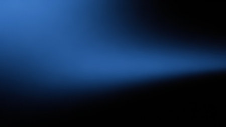 A deep blue gradient fades into a dark black background with a subtle, soft light beam across the middle.の素材