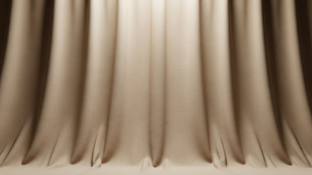 Beige fabric curtains are draped with soft light creating a textured background Clear details and vibrant colo...の素材