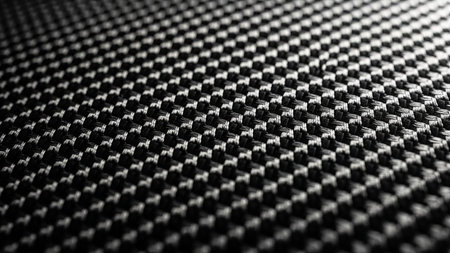 An abstract macro view of a black and white woven carbon fiber texture with a repeating geometric pattern.の素材