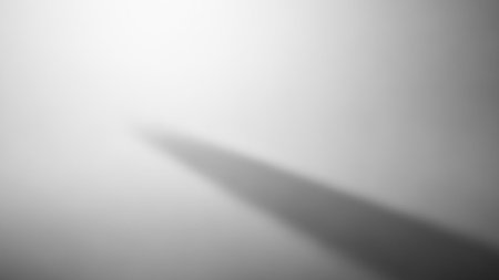 A soft focus gradient background with a subtle diagonal shadow creating a sense of depth and space.の素材