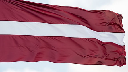 Category: showing latvian flag with maroon and white stripes waving in the sky keywords: latvia, flag, national symbol, patriotism, independence,...の素材