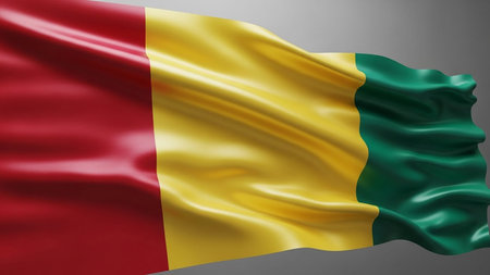A realistic 3D rendering of the flag of Guinea waving with its red, yellow, and green vertical stripes against a neutral gray background.の素材
