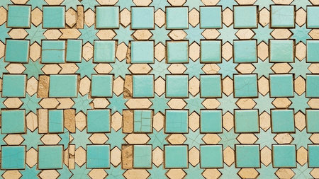 A close-up of a turquoise and beige geometric Islamic tile pattern showing a cracked and weathered texture with visible grout lines.の素材