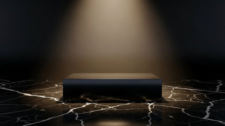 A black rectangular pedestal sits on a dark marble floor, illuminated by a dramatic golden spotlight from above.の素材