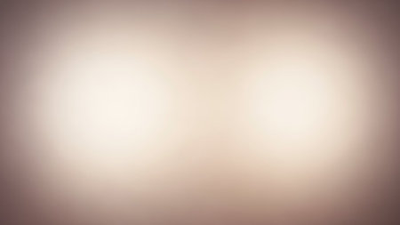 A soft focus abstract background featuring two bright, diffused light orbs against a smooth, neutral gradient.の素材