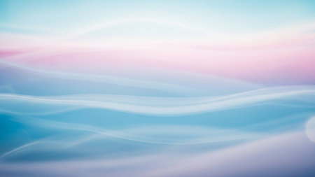 Ethereal abstract waves of light pink and blue smoke flowing softly with a dreamy feel.の素材