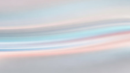 A soft horizontal blur creates an abstract background with gentle streaks of pastel blue, pink, and grey.の素材