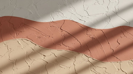 A textured wall features wavy layers of terracotta and beige plaster with dappled shadows.の素材