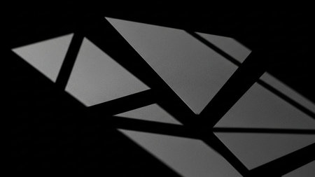 Surface showing geometric abstract shapes with sharp shadows on black background keywords: abstract,...の素材