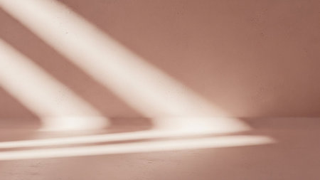 A textured pink wall and floor are illuminated by diagonal beams of light, creating soft shadows.の素材