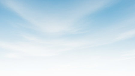 A soft gradient of pale blue sky with wispy white clouds creates a serene and airy background.の素材