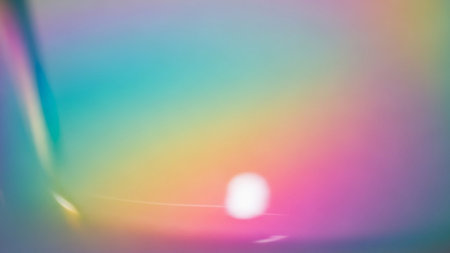 A soft focus background displays a gentle rainbow gradient with blurred bokeh lights and subtle highlights, creating a dreamy atmosphere.の素材