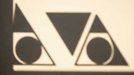 Light showing geometric shapes shadow play on textured wall keywords: shadow, geometric, shapes, triangle,...の素材