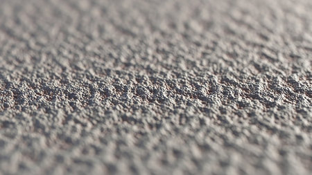 Textured showing close up macro shot of a rough textured gray concrete surface with shallow depth of field and soft light keywords: texture,...の素材