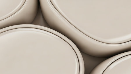 View showing close up macro view of smooth beige ceramic bowls stacked together with soft curves and subtle shadows. resolutionの素材
