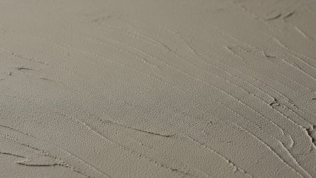 Photo showing close-up of textured concrete surface with swirls. High resolution image suitable for...の素材