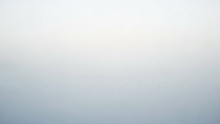 A soft focus abstract background with a gentle gradient from light blue to white. Clear details and vibrant co...の素材