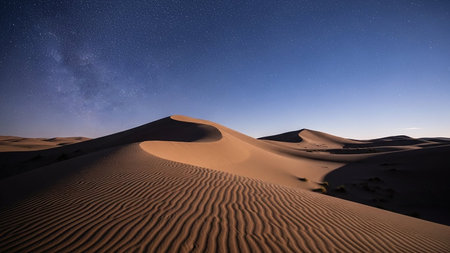 Vast desert sand dunes with intricate ripples under a clear starry night sky. Clear details and vibrant colors...の素材