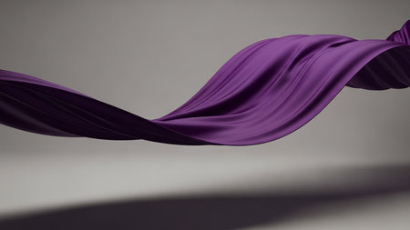 A piece of flowing purple silk fabric swirling gracefully in a studio with soft lighting and shadows.の素材