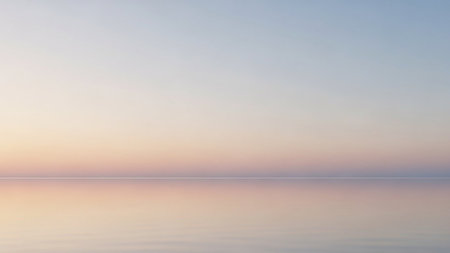 A serene, minimalist seascape a soft pastel gradient sky reflecting on a perfectly still, calm body of water, creating a tranquil and peaceful...の素材