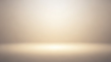 Warm showing a softly lit studio background with a bright white light source at the bottom fading upwards into a gentle gradient of warm beige and...の素材