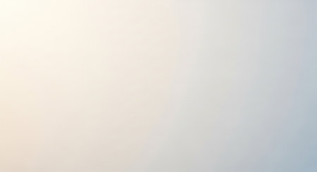 Background showing soft gradient background with subtle light yellow and blue hues transitioning smoothly across the frame creating a gentle and...の素材