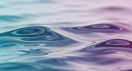 Ripples showing close-up of gentle water waves with subtle ripples and reflections in soft blue and purple tones creating a calm and serene abstract...の素材