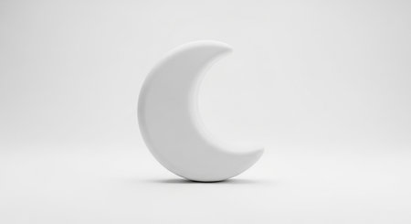 A smooth, matte white crescent moon is positioned centrally on a seamless white background, casting a subtle shadow.の素材