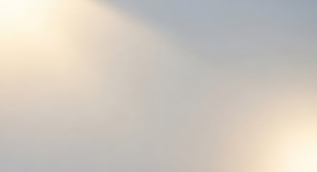 A soft focus abstract background with gentle warm light gradients and subtle illuminationの素材