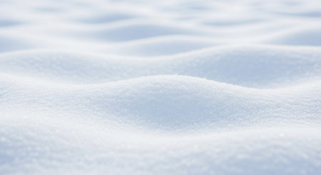 Softly lit snowdrifts create gentle undulating curves and a smooth white texture. Clear details and vibrant co...の素材