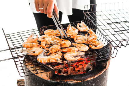 seafood delicious grilled shrimp, prawn with hot flames in backgroundの写真素材