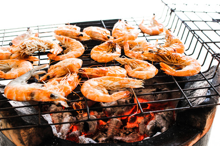 seafood delicious grilled shrimp, prawn with hot flames in backgroundの写真素材