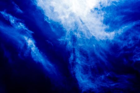 blue sky dark storm with white cloud backgroundの写真素材