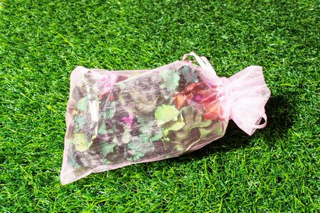 potpourri on green grass texture background eco conceptの写真素材