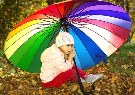 Little girl with umbrellaの写真素材