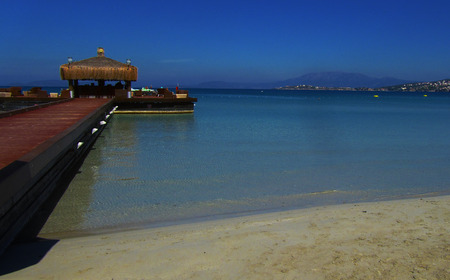 The pleasure of the Aegean Sea. View of a beach in Cesme, Turkey.の写真素材
