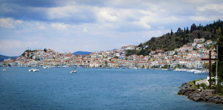 Greek island with colorful houses and yachts.の写真素材