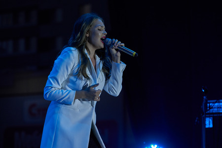 Ulyanovsk, Russia - August 18, 2018. Solo performance of the pop singer Guzeli Hasanoy at a street concert.のeditorial素材