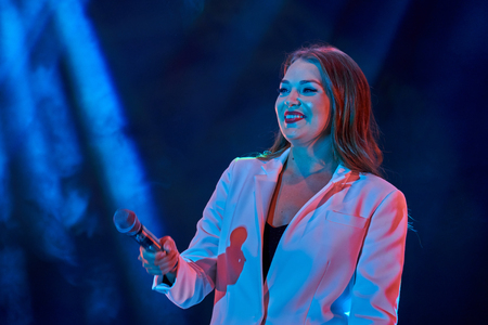 Ulyanovsk, Russia - August 18, 2018. Solo performance of the pop singer Guzeli Hasanoy at a street concert.のeditorial素材