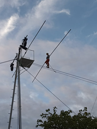 A person is balancing on a tightrope.の写真素材