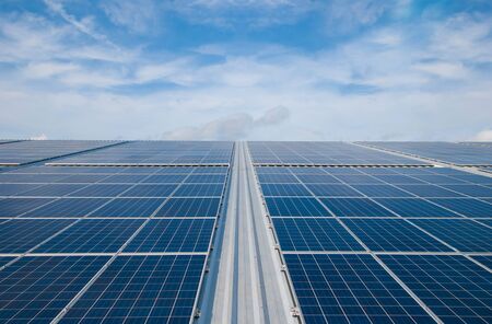 a solar panel or photovoltaic modules with a cloud background for renewable energyの写真素材