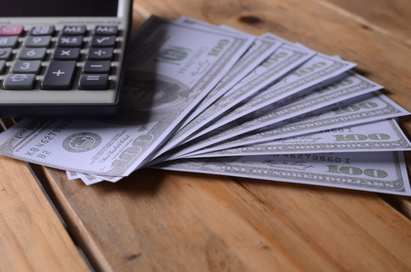 A calculator on an  America Dollar Note or money background, business concept