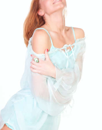 A beautiful young woman in a blue tunic with a white background