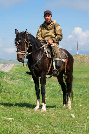 Nomad with his faithful horse in the steppes of Mongoliaの写真素材